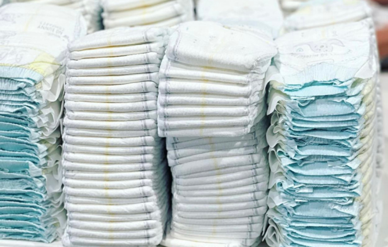 Stacks of Diapers waiting to be processed at Helping Mamas